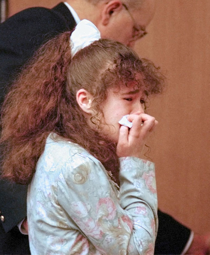 Christa Pike crying in a courtroom setting during her trial.