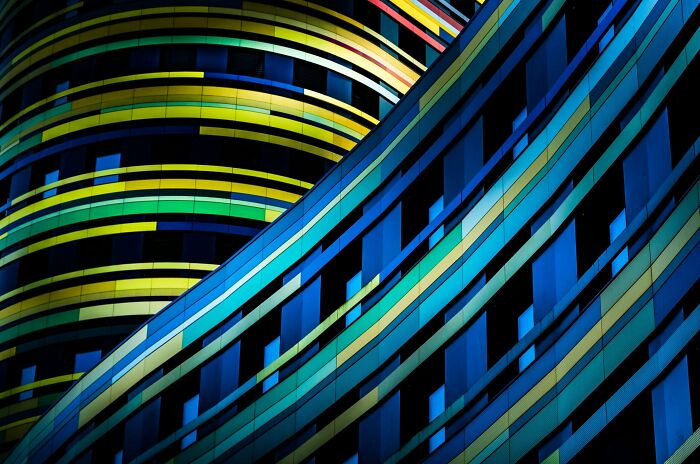 Close-up of a colorful building with wavy blue and yellow patterns, entered in The Perspa Awards 2026