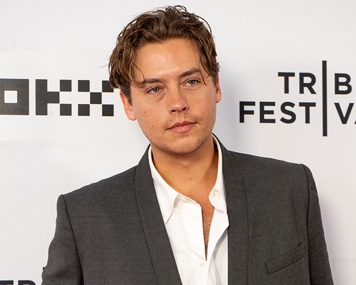 Cole Sprouse looking forward at a red carpet event