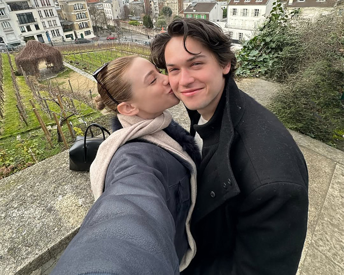 A couple smiling outdoors as online rumors about Cole Sprouse spread