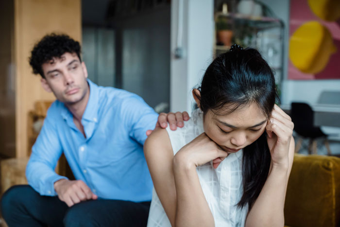 Couple arguing showing tension caused by toxic mom control Couple arguing showing tension caused by toxic mom control