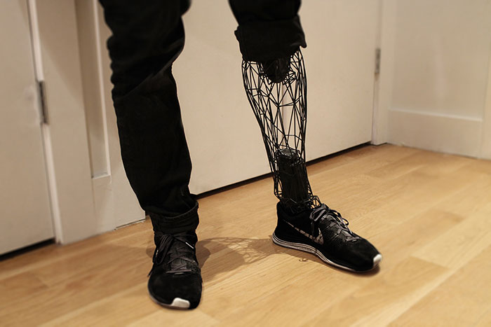 A futuristic 3D printer prosthetic leg with a geometric wireframe design