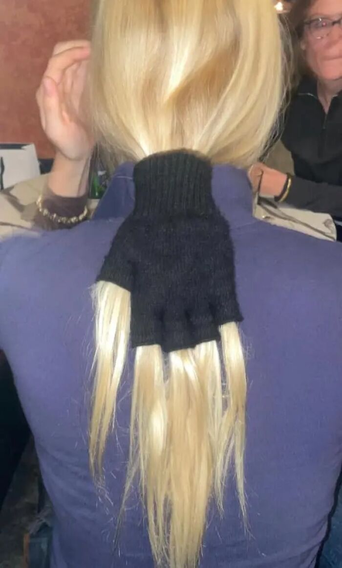 Black glove tied around blonde hair resembling a hand in cursed images