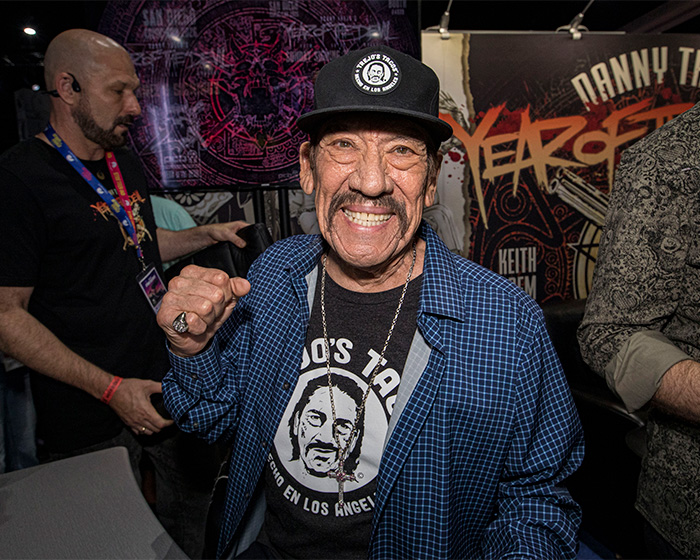 82 year old action hero smiling with a fist raised at event 82 year old action hero smiling with a fist raised at event