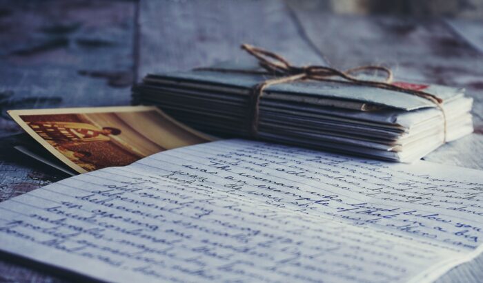 Stack of old love letters and handwritten note, symbolizing memories of a lost wife after a family tragedy. Stack of old love letters and handwritten note, symbolizing memories of a lost wife after a family tragedy.