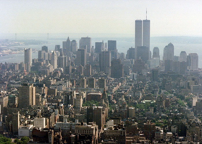 Aerial view of the New York City skyline with the World Trade Center towers, related to online mysteries.