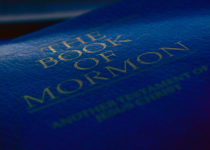 Close-up shot of the blue cover of The Book of Mormon featured in strange online mysteries.