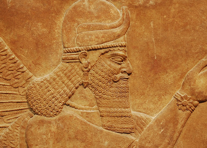 An ancient relief carving of a winged figure illustrating online mysteries.