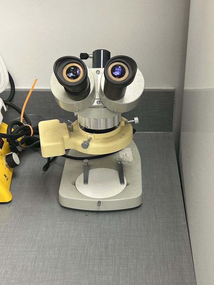 A microscope looking like a face, fitting absurd products and funny visual moments.
