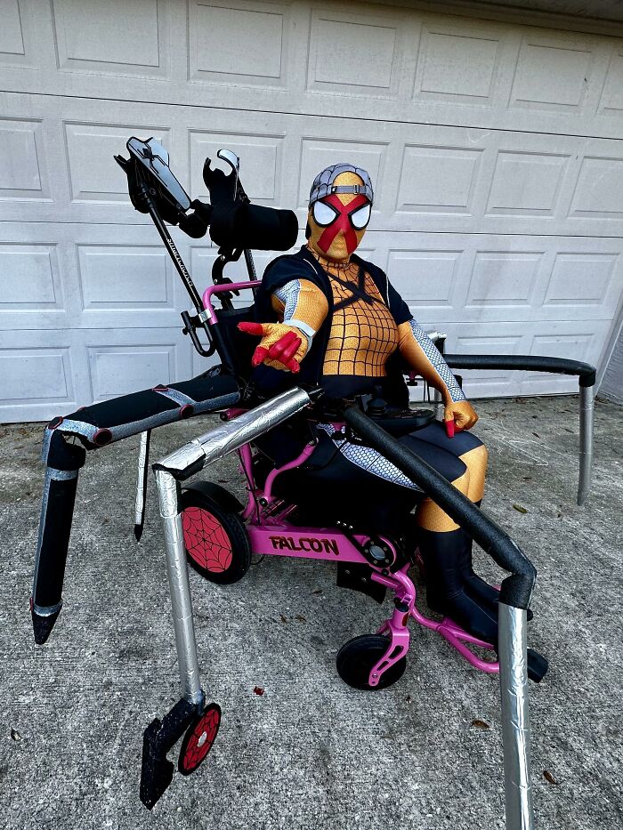 Creative Spider-Man costume incorporating a wheelchair with robotic spider legs.