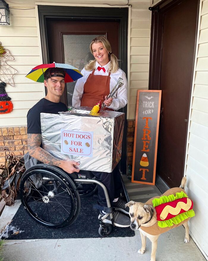 A man in a wheelchair with a hot dog stand costume celebrating Halloween creatively.