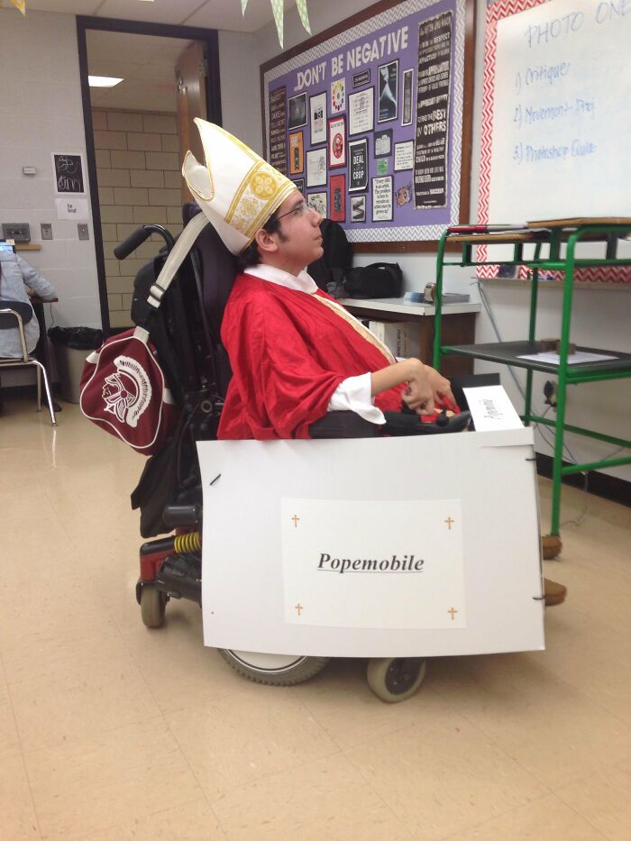 Student in a wheelchair disguised as the Popemobile celebrating creative people with disabilities Halloween costumes
