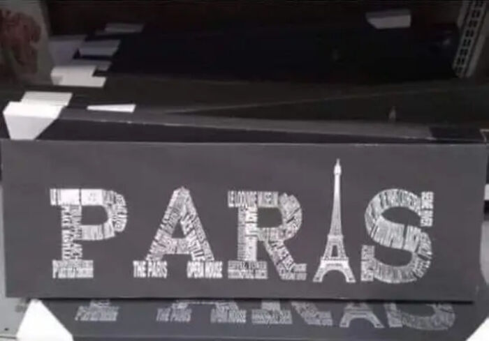 A decorative sign representing absurd products with the word Paris spelled incorrectly