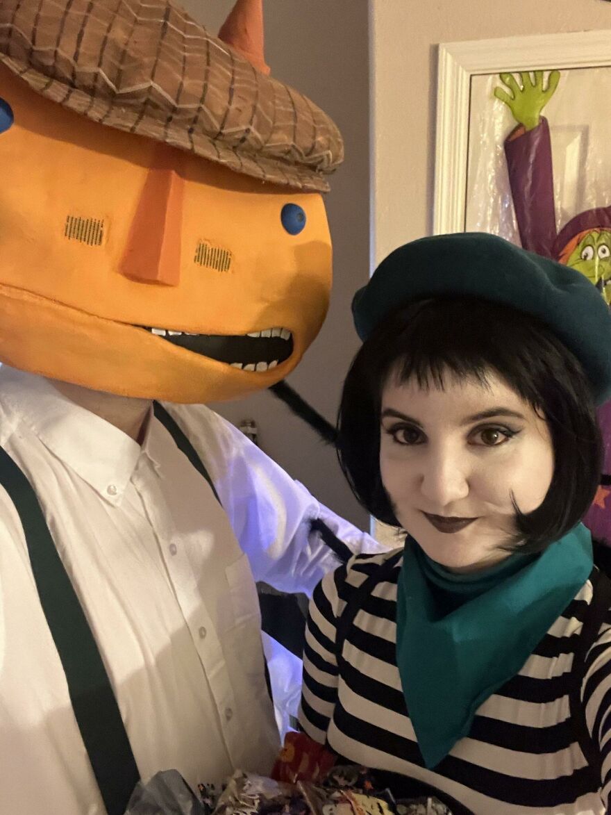 Couple dressed up as storybook characters for a unique creative Halloween costume idea.