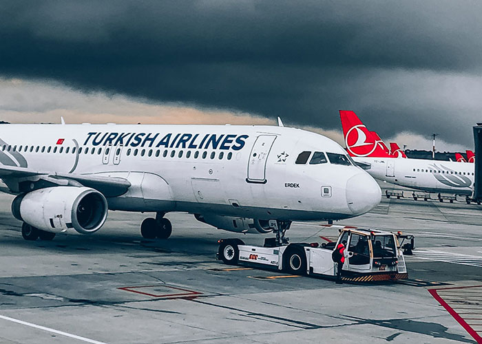 Turkish Airlines airplane parked on runway at airport