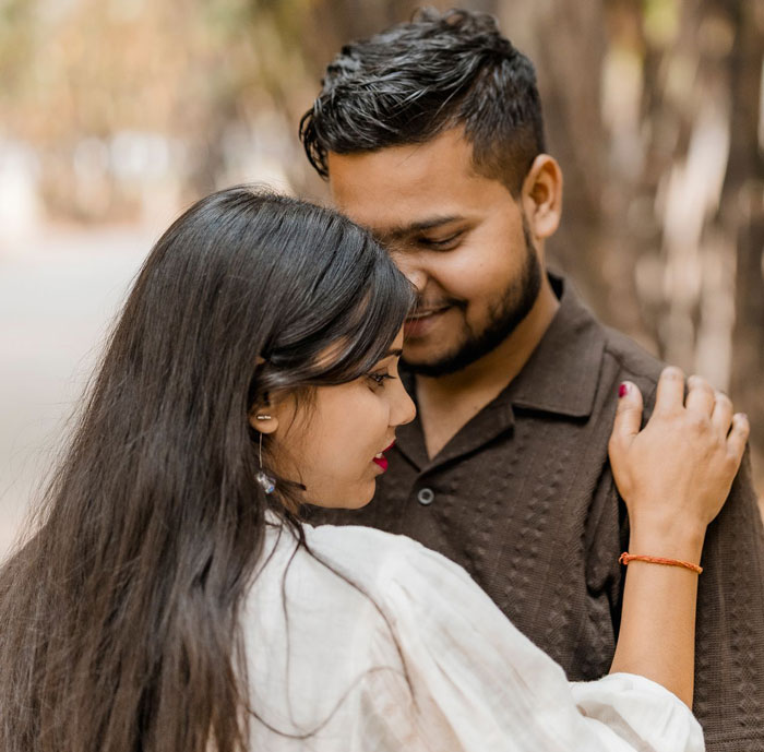 South Asian couple embracing in engagement photo South Asian couple embracing in engagement photo