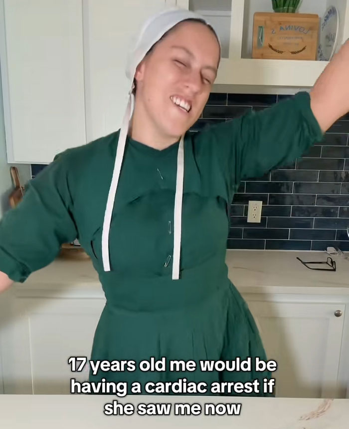 Lovina Zook wearing traditional headwear and a green dress, reflecting on her journey from growing up Amish. Lovina Zook wearing traditional headwear and a green dress, reflecting on her journey from growing up Amish.