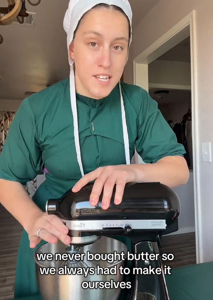 Lovina Zook in Amish attire using a stand mixer to make homemade butter Lovina Zook in Amish attire using a stand mixer to make homemade butter
