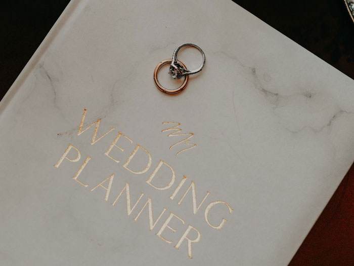 Wedding planner book with two rings on top representing wedding planning Wedding planner book with two rings on top representing wedding planning