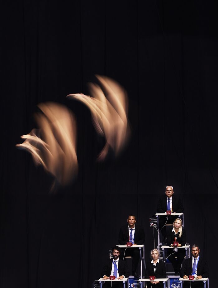Artistic motion blur of jumpers in suits at Siena International Photo Awards 2026