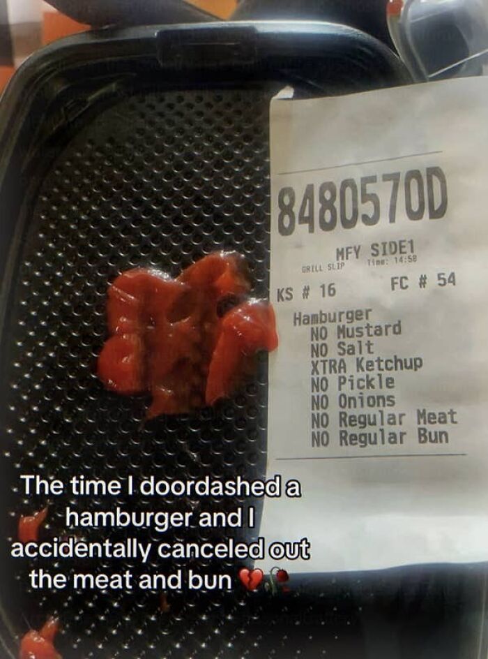 Burger container with ketchup and receipt showing no meat or bun in cursed food order