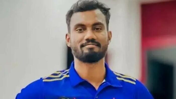 A portrait of a Sri Lankan citizen in a blue shirt with gold details, facing blasphemy charges. A portrait of a Sri Lankan citizen in a blue shirt with gold details, facing blasphemy charges.