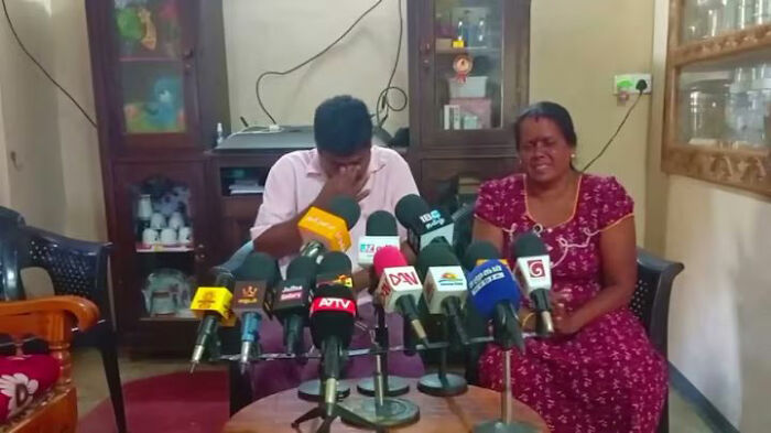 Distressed family members of a Sri Lankan citizen sitting behind microphones at a press briefing. Distressed family members of a Sri Lankan citizen sitting behind microphones at a press briefing.
