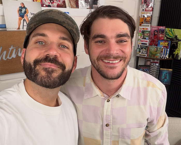RJ Mitte posing for a photo alongside a podcast host. RJ Mitte posing for a photo alongside a podcast host.