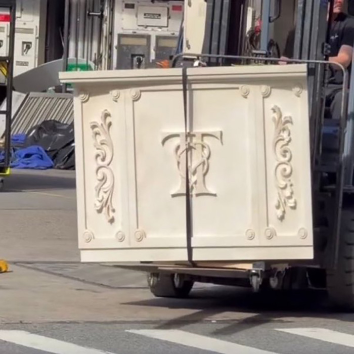 A forklift moving elaborate wedding decor items featuring a custom monogram logo A forklift moving elaborate wedding decor items featuring a custom monogram logo