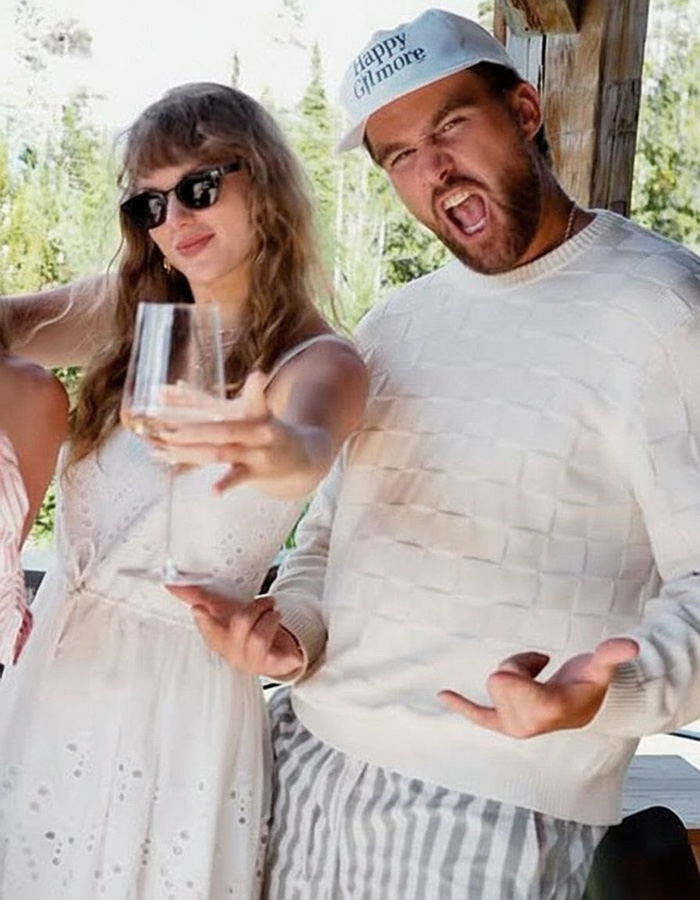 Taylor Swift holding a drink alongside Travis Kelce wearing a Happy Gilmore cap Taylor Swift holding a drink alongside Travis Kelce wearing a Happy Gilmore cap