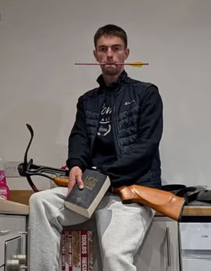 Man posing with a rifle and arrow, linked to tiger enclosure case involving former child actor