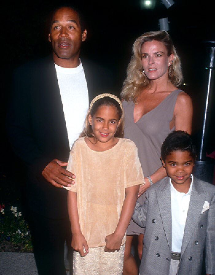 O.J. Simpson and Nicole Brown Simpson with their two children posing for a family photo. O.J. Simpson and Nicole Brown Simpson with their two children posing for a family photo.