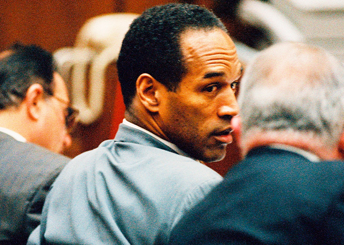 O.J. Simpson looking back in a courtroom during the famous O.J. Simpson case trial O.J. Simpson looking back in a courtroom during the famous O.J. Simpson case trial