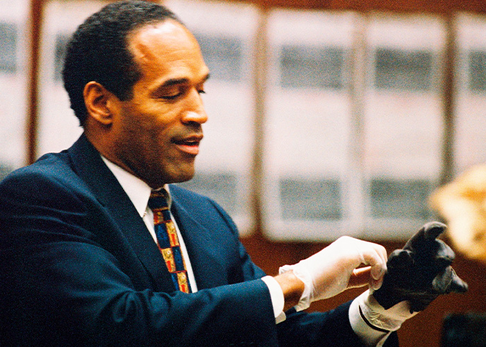 O.J. Simpson trying on the famous leather glove during his trial in the O.J. Simpson case O.J. Simpson trying on the famous leather glove during his trial in the O.J. Simpson case