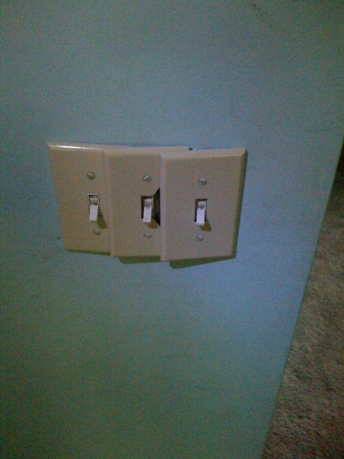 Three misaligned light switches overlapping each other on a wall, depicting a failed plan to improve their homes.