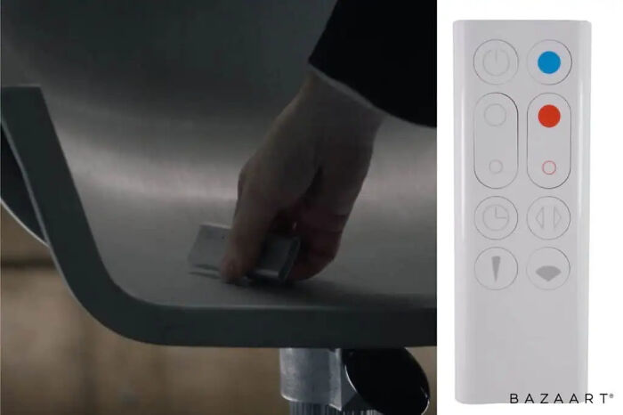 A hand placing a white remote control on a chair, showcasing clever movie props.