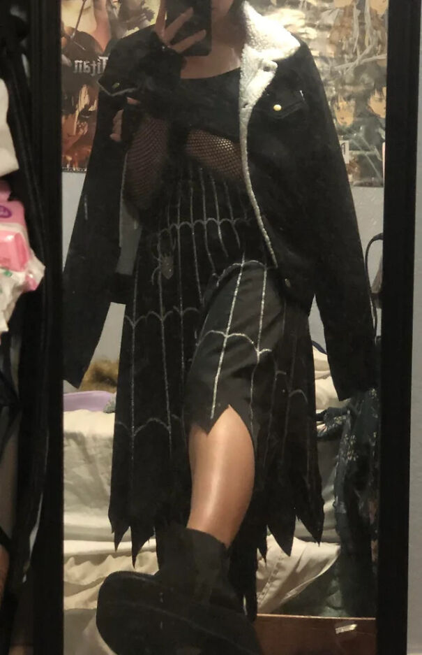 A person wearing a spider web skirt as part of creative Halloween costume ideas.