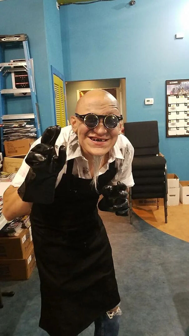 A man wearing a mad scientist outfit as a cool Halloween costume idea.