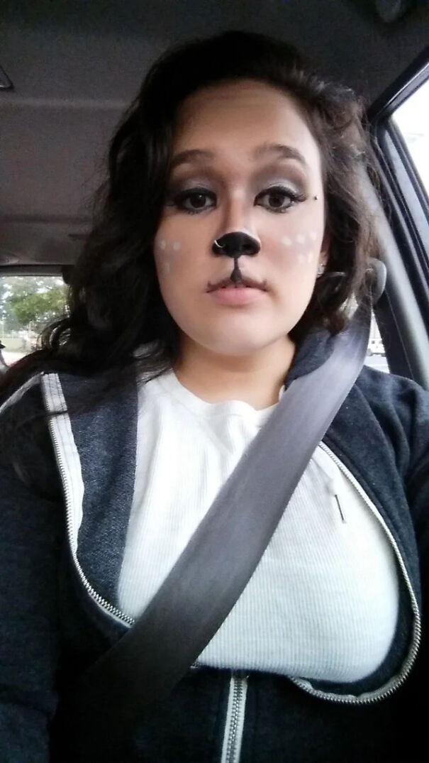 Woman sitting in a car with deer makeup as a last-minute Halloween costume idea