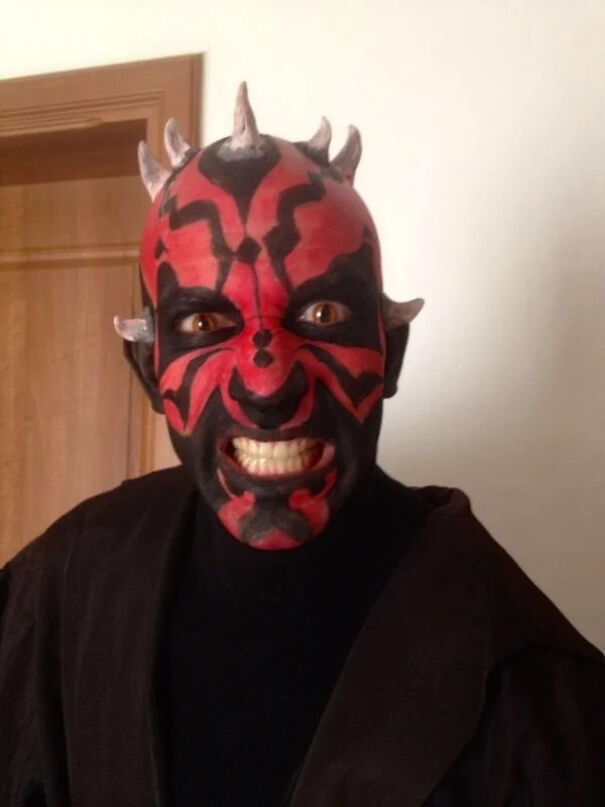 Person with detailed Darth Maul face paint as a cool Halloween costume idea