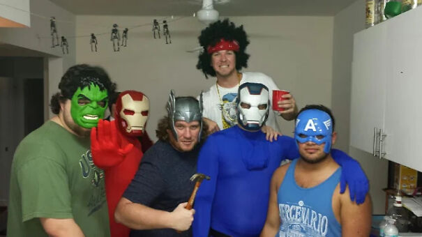 Group of friends wearing superhero masks for a budget friendly Halloween costume idea.