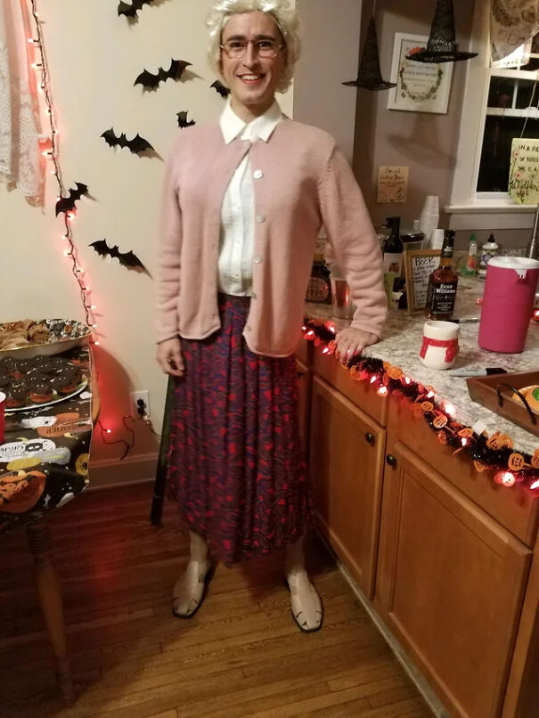 Man dressed in an elderly woman outfit for a creative Halloween costume idea.