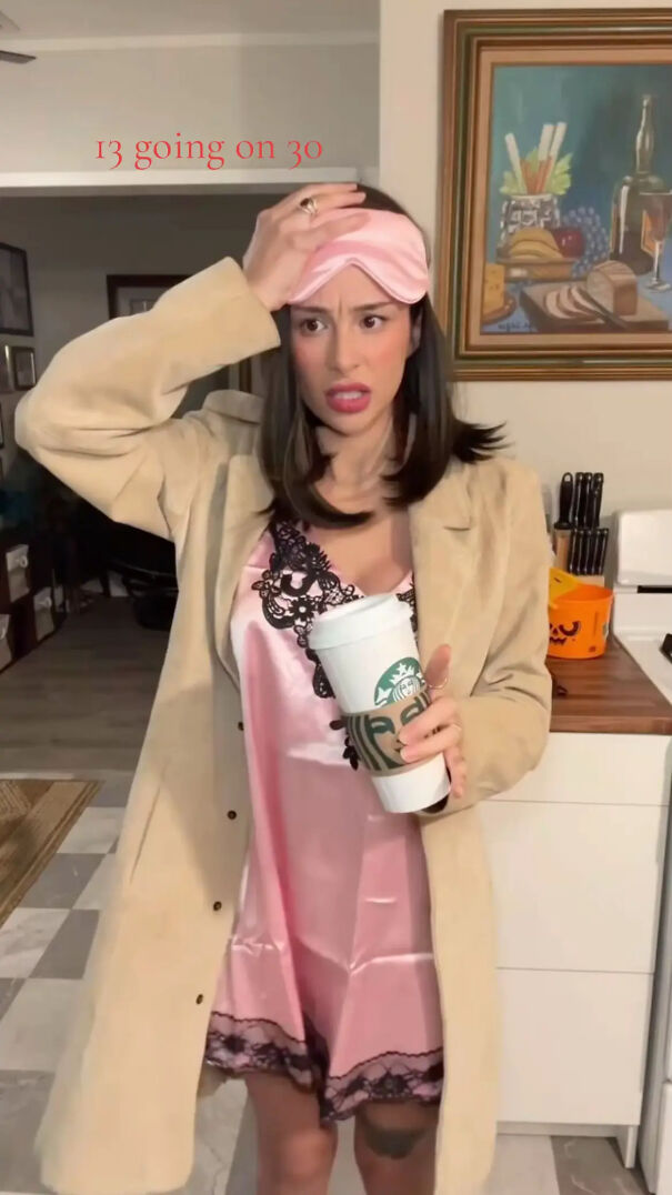 Woman dressed in a nightgown and trench coat as a 13 Going on 30 Halloween costume idea.
