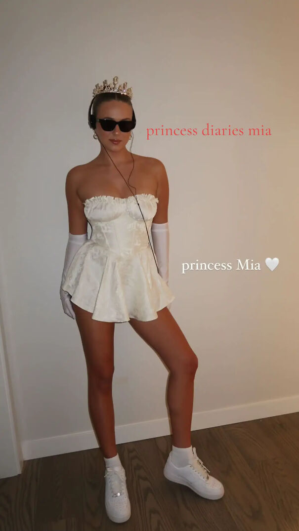 A woman wearing a tiara, sunglasses, and white dress for last minute Halloween costume ideas.