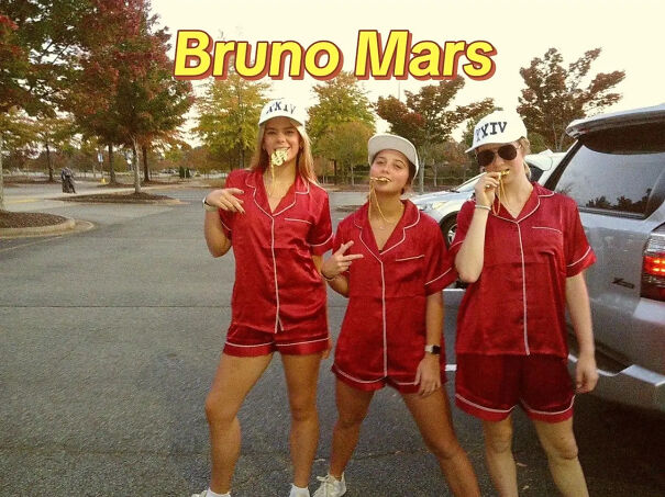 Three women wearing matching red silk pajamas for a Bruno Mars Halloween costume idea