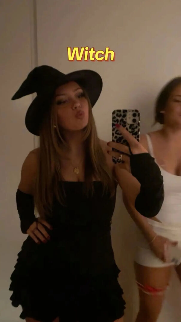 A woman wearing a black pointy witch hat as a simple Halloween costume idea