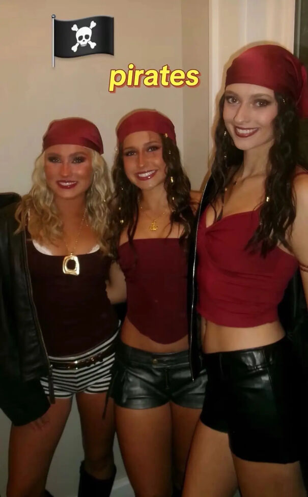 Three women wearing red bandanas as part of a pirate Halloween costume idea