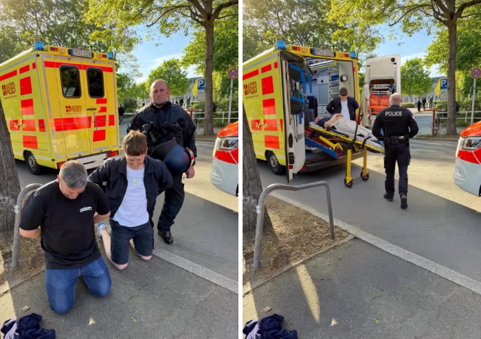 Photoshopper edit removing two arrested men and replacing them with a patient on a stretcher near an ambulance.