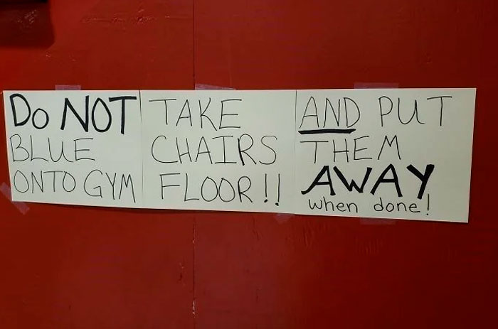 A sign with confusing labels that can be read in multiple wrong ways about gym chairs.