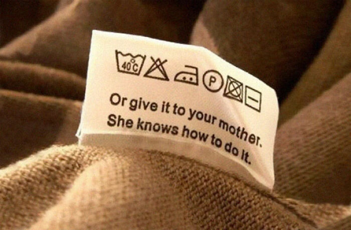 A funny clothing tag with laundry symbols and confusing instructions telling you to give it to your mother.